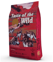 Taste of the Wild - Southwest Canyon - Wild Boar, Beef & Lamb - Grain Free Dry Dog Food - 12.2kg package with dogs.