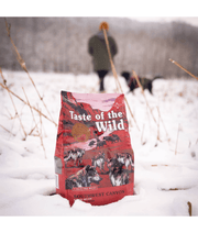 Taste of the Wild - Southwest Canyon - Wild Boar, Beef & Lamb - Grain Free Dry Dog Food - 12.2kg in snowy landscape.