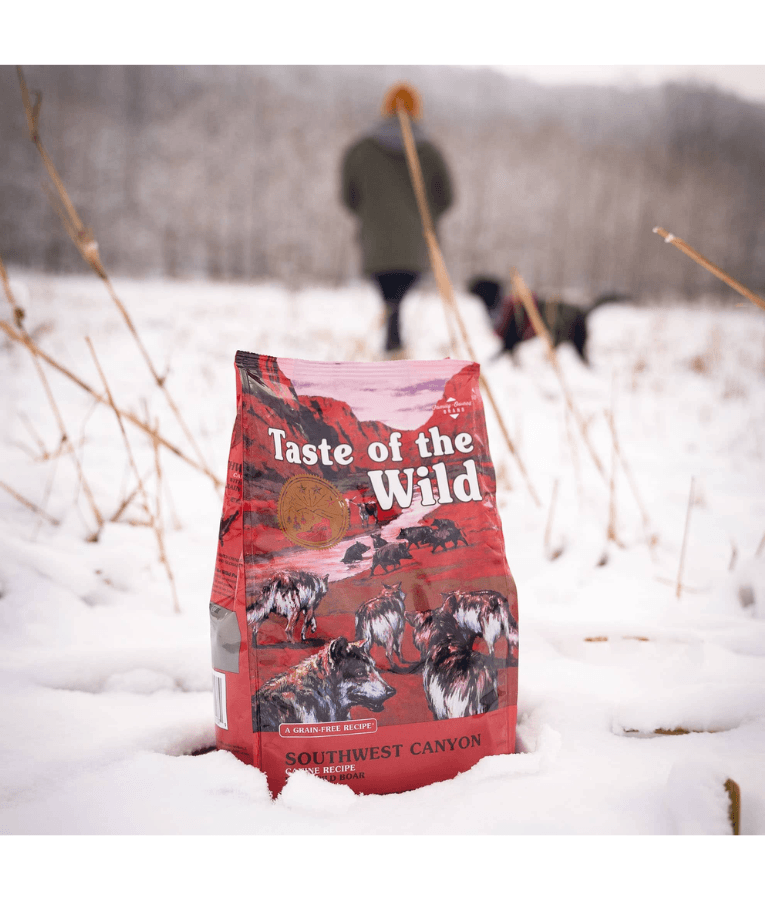 Taste of the Wild - Southwest Canyon - Wild Boar, Beef & Lamb - Grain Free Dry Dog Food - 12.2kg in snowy landscape.