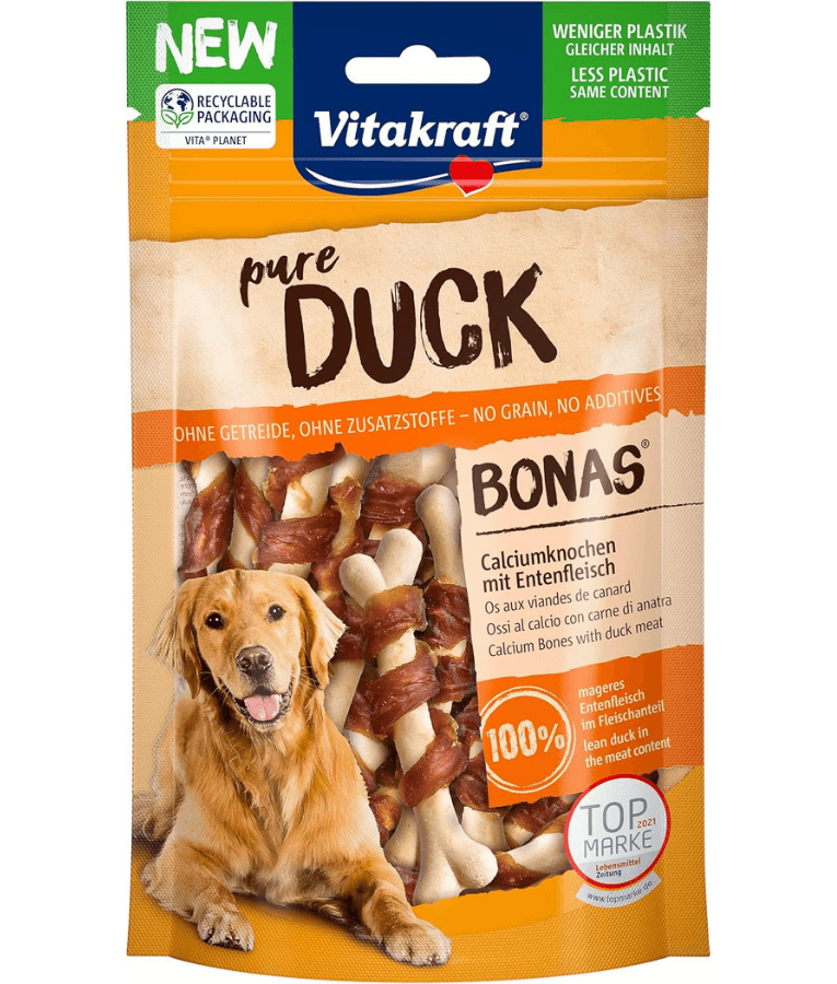 Vitakraft Pure Duck Bonas dog calcium bones, high protein training treat for all life stages, 80g package with dog.