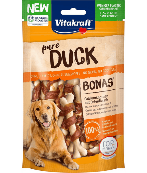 Vitakraft Pure Duck Bonas dog calcium bones, high protein training treat for all life stages, 80g package with dog.
