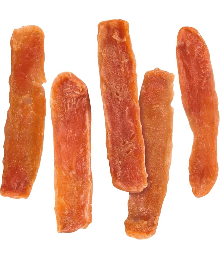 Vitakraft Pure Chicken dog food dog treats, 100% chicken breast fillet sticks on a white background.